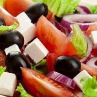 Salata Dobrogeana · Lettuce, tomatoes, cucumber, onion, olives and feta cheese, olive oil and vinegar.