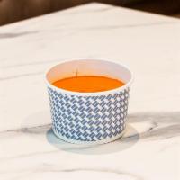 Tomato Basil Cup · Our signature soupe - a house-made cream-based vegetarian soupe made with juicy, vine-ripene...