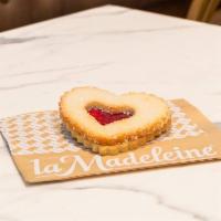 Linzer Cookie · Classic heart-shaped shortbread cookies sandwiched with raspberry jam and sprinkled with cry...