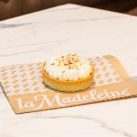 Coconut Crème Tartelette · Mini pastry shell hand-filled with pastry cream topped with light Chantilly cream & toasted ...