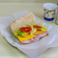Ham Sandwich with Cheese · Thinly sliced meat from a pig.'s leg.