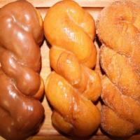 Cinnamon Twist Donut  · Glazed, choco, or cinnamon sugar topped.