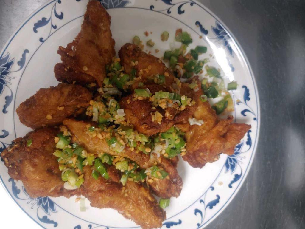 2. Stir Fried Chicken Wings with Salt and Pepper  · Golden fried flats and drumsticks tossed in fried garlic, jalapenos, and green onions