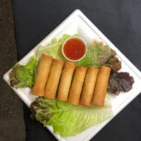 4. Deep Fried Egg Roll · House made with chicken, carrots, cabbage, onions wrapped in rice paper then fried until gol...