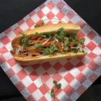 V3. Grilled Chicken Bánh Mì  · Bánh mì gà nướng. Marinated grilled chicken, pickled carrots & daikon slaw, cucumbers, slice...