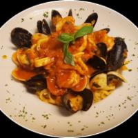 Seafood Combo · Served with your choice: red or white sauce. Served over linguine or your choice of spaghett...