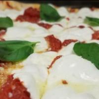Margherita Pizza · Plum tomato sauce, fresh mozzarella cheese, basil, olive oil.