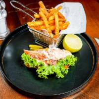 Lobster Roll · Baked lobster with lemon aioli served with truffle frites.