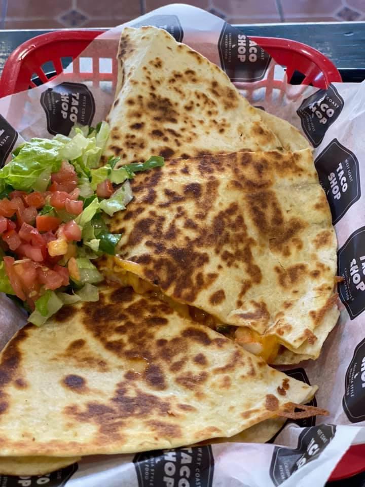 Chicken Quesadilla · Marinated boneless, skinless chicken, grilled & simmered in our own Mexican salsa. Placed on a flour tortilla then grilled & stuffed with melted cheese, beans, guacamole & sour cream.