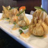 OL Spicy Lobster Dumpling ** · Guacemole Topped with lobster dumpling, jalapeño, masago and sweet spicy sauce.