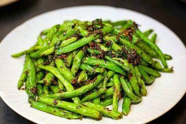 Sauteed string beans 干煸四季豆 · Ingredients: string beans, olive leaves, garlic