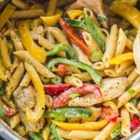 Rasta Pasta · creamy pasta tossed with jerk chicken and bell peppers. This dish is so full of flavor