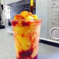 Mangonada · A mango slushy with fresh mango chunks ,that includes chamoy drizzle and tajin.