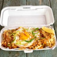 Palabok Waffle Fries · Waffle fries layered with a golden shrimp and pork gravy topped with a fried egg, chicharron...