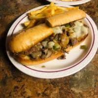 Philly Cheesesteak · Thinly sliced beef atop a sub with green peppers, onions, and Swiss cheese. Served with side.