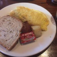 Cheese Omelette · 3 eggs scrambled with your choice of cheese. Served with home fries and toast.