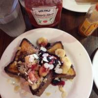 French Toast Combo · 4 slices of thick, egg-washed cinnamon bread served with maple syrup and powdered sugar, plu...