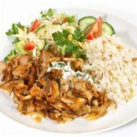 Halal Lamb and Chicken Over Rice and Salad · Halal lamb and chicken vegetables over a bed of rice.