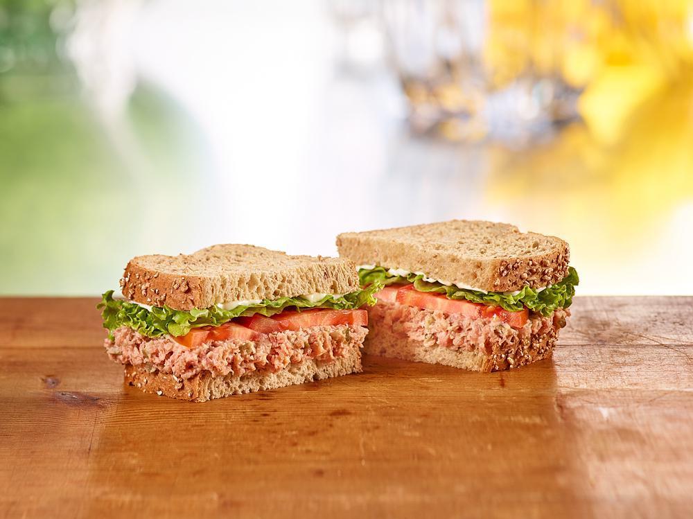 Ham Salad Sandwich Meal · Honey Baked Ham Salad topped with lettuce, tomato, and Duke’s® Mayonnaise on multigrain bread. Comes with a side and drink. 230-1480 cal.