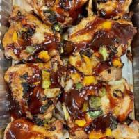 Chicken Thighs · 10 pieces. Seasoned with a Memphis style dry rub and then covered with our mild pepper mix f...