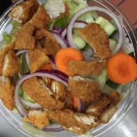 83. Crunchy Chicken Tender Salad · Carefully cutted tender over green.