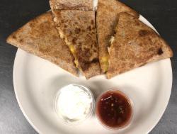 Grilled Chicken Quesadilla · Tortilla baked with mozzarella, cheddar jack and grilled chicken.