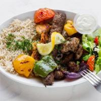 Rotana Royal Kabob · Includes rice, salad and hummus.