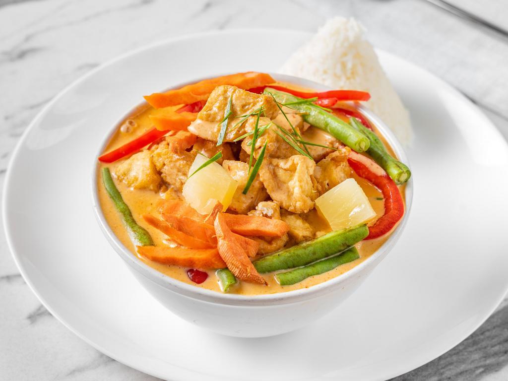 Vegan Panang Curry · Red creamy Thai chili paste with string beans, bell peppers, carrots and pineapple with coconut milk. Served with rice. Spicy. Gluten free.
