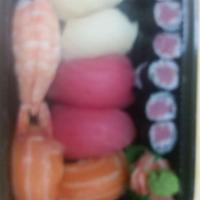 C11. Sushi Regular Combo · 7 pieces of sushi and tuna or California roll.