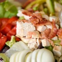 Cobb Salad · Mixed green salad with marinated chicken breast, bacon, avocado, tomato and sliced egg.