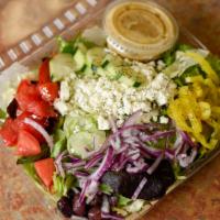 Greek Salad · Crumbled feta cheese, dill, tomato, onion, cucumber, Greek olives and pepperoncini on a bed ...