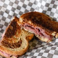 Pastrami Reuben · Hot pastrami and Swiss on grilled rye with sauerkraut and Thousand Island dressing.
