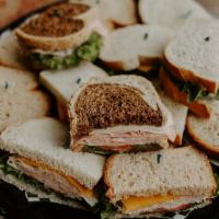 Supreme Sandwich Tray  · Assortment of Supreme Sandwiches Turkey, Ham, Roast Beef and Veggie w/lettuce, tomato and ma...