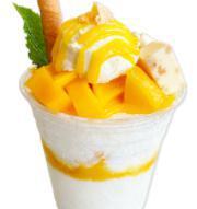 Mango Bingsoo · Milk shaved ice cereal mango, mango sauce, mango mascarpone, cheesecake, mint rolled cigar c...