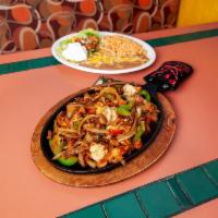 Fajitas · Your choice of steak, chicken or shrimp marinated in our secret sauce, then delivered sizzli...