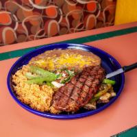 Cuautla Torero Steak · 11 oz. of top sirloin broiled over charcoal with sauteed onions and green peppers, avocado, ...