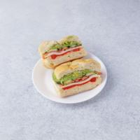 9. Veggie Sandwich · Fresh mozzarella, roasted peppers, avocado, romaine lettuce, tomato and cucumbers.