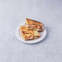 P1. Turkey Club Panini · Cracked peppermill turkey, Swiss cheese, crispy bacon, lettuce, tomato and mayonnaise.