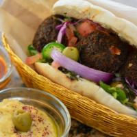 Falafel · Ground Chickpea Falafel Balls, Lettuce, Tomato, Purple Cabbage, Cilantro & Cucumber Salad in...