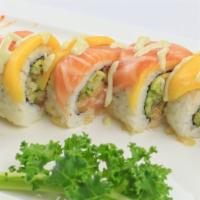 Hard Rock Roll · Spicy salmon, cucumber, avocado and crunch, topped with salmon, mango, and mango sauce.