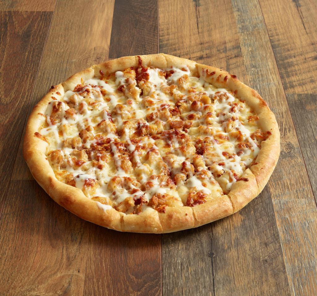 Chicken Bacon Ranch Pizza · A layer of garlic sauce lopped with chicken, bacon, mozzarella and swirled with ranch dressing.