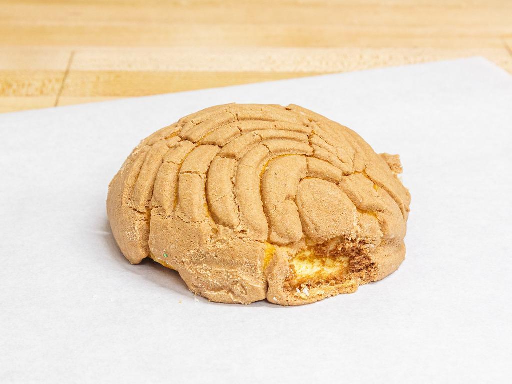 Concha de Chocolate · The name means shells, and are perhaps the most popular of the Mexican pan dulce. This pillowy soft, brioche texture rounded breads are topped with a chocolate buttery sugar flavored coating which typically has a seashell like pattern.