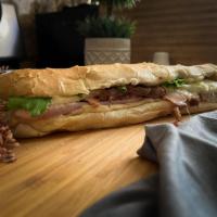 Cubano Sandwich · Chef’s Favorite! our signature Cuban Sandwich: Slow-smoked ham, roast pork, mozzarella, all ...