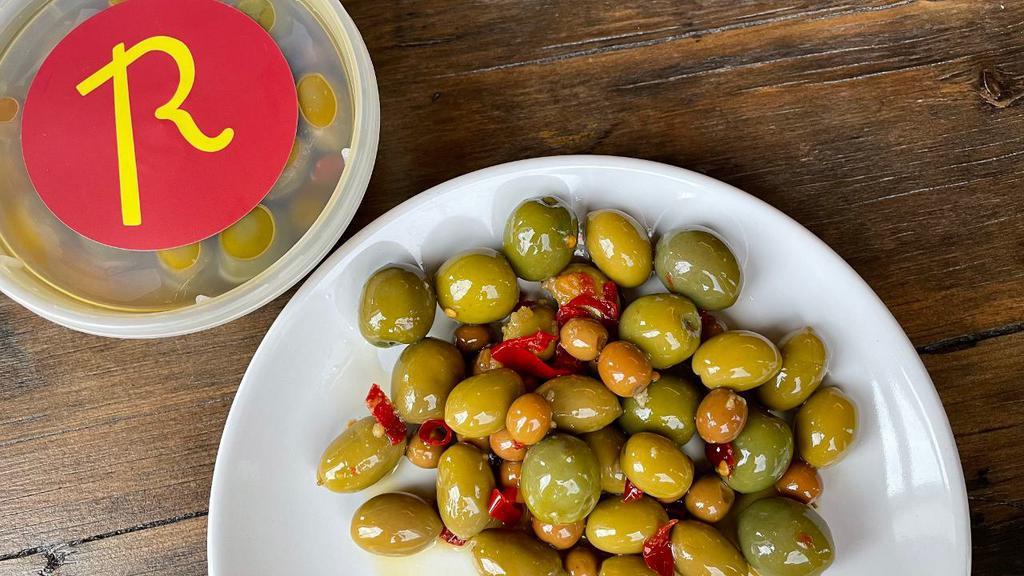 Marinated Olives · olives marinated in olive oil, garlic, lemon, calabrian chili, oregano