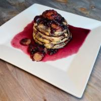 Strawberry, Banana, Blueberries & Maple Syrup Pancakes - (18g Protein) · 18g of Protein - Four pancakes with a strawberry, banana, and blueberry reduction maple sauce.