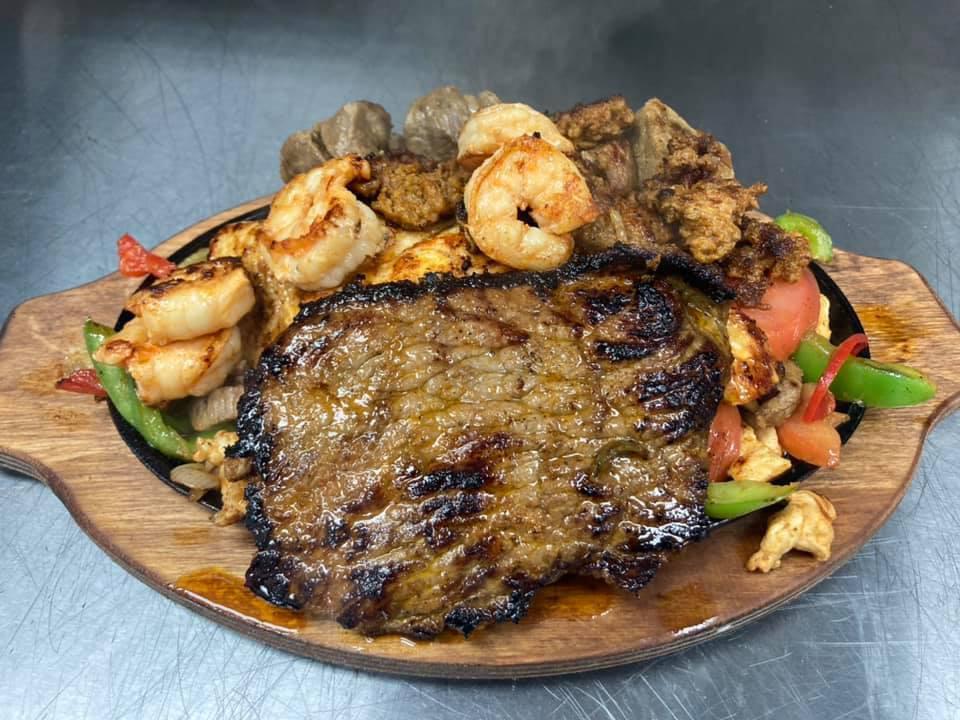 Tequilas Fajita · Steak, chicken, and shrimp grilled with mushrooms, onions, bell peppers, broccoli, carrots, cauliflower.