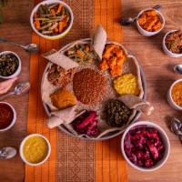 New! Ethiopian 8-dish Feast  - Serves 6 · An eight dish Ethiopian feast. All vegan and gluten free. 

Misr - Spicy red lentils - Ater ...