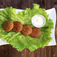 Falafel Plate · 5 pieces of falafel served with tahini sauce, pickles, lettuce.