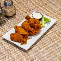 Chicken Wings · 8 of our famous jumbo chicken wings dusted with secret spices and fried golden brown, served...
