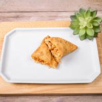 Buffalo Chicken Empanada · Pollo Buffalo. Tender shredded chicken and Buffalo sauce. Medium hot.